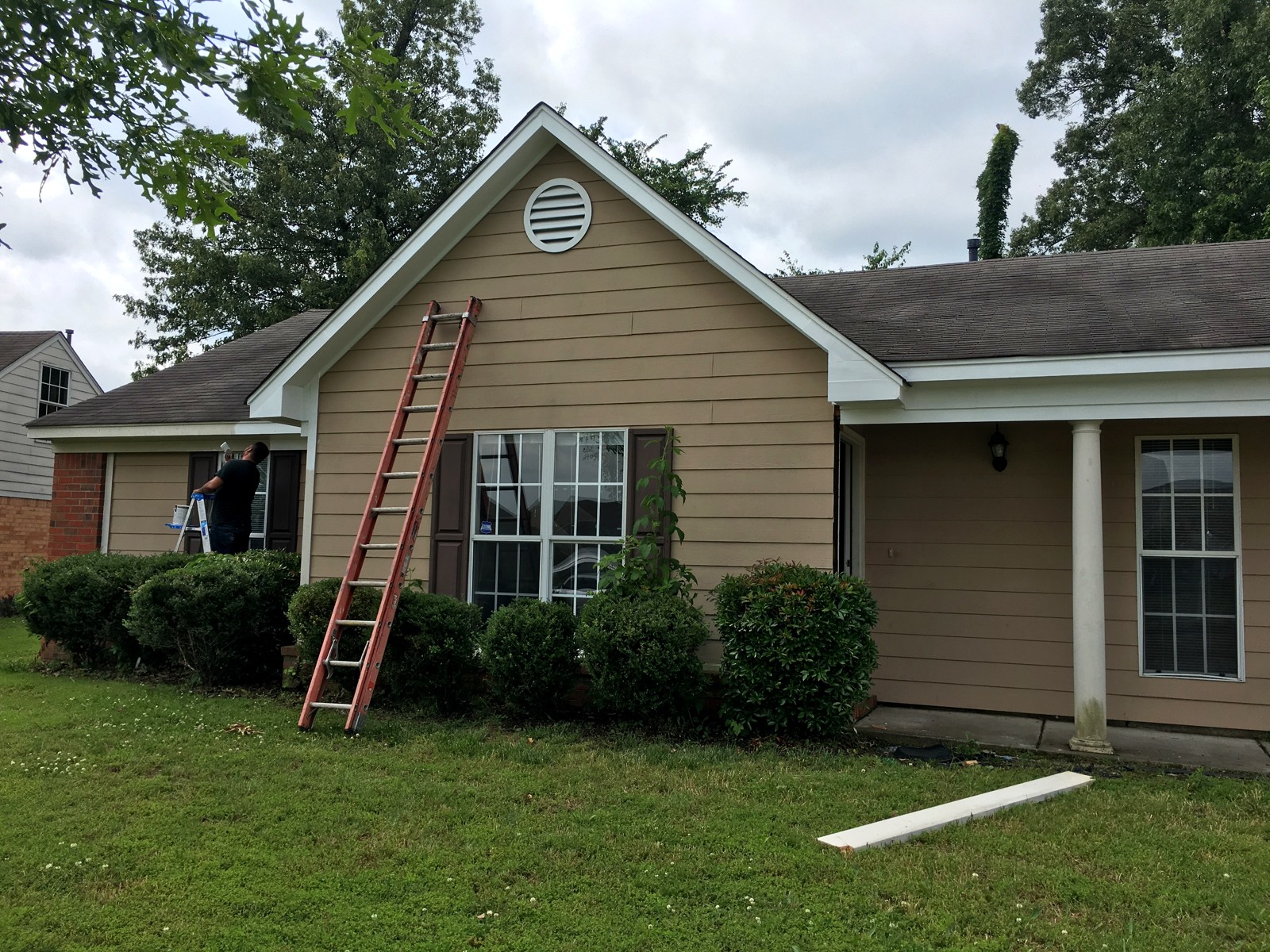 Exterior siding being repainted