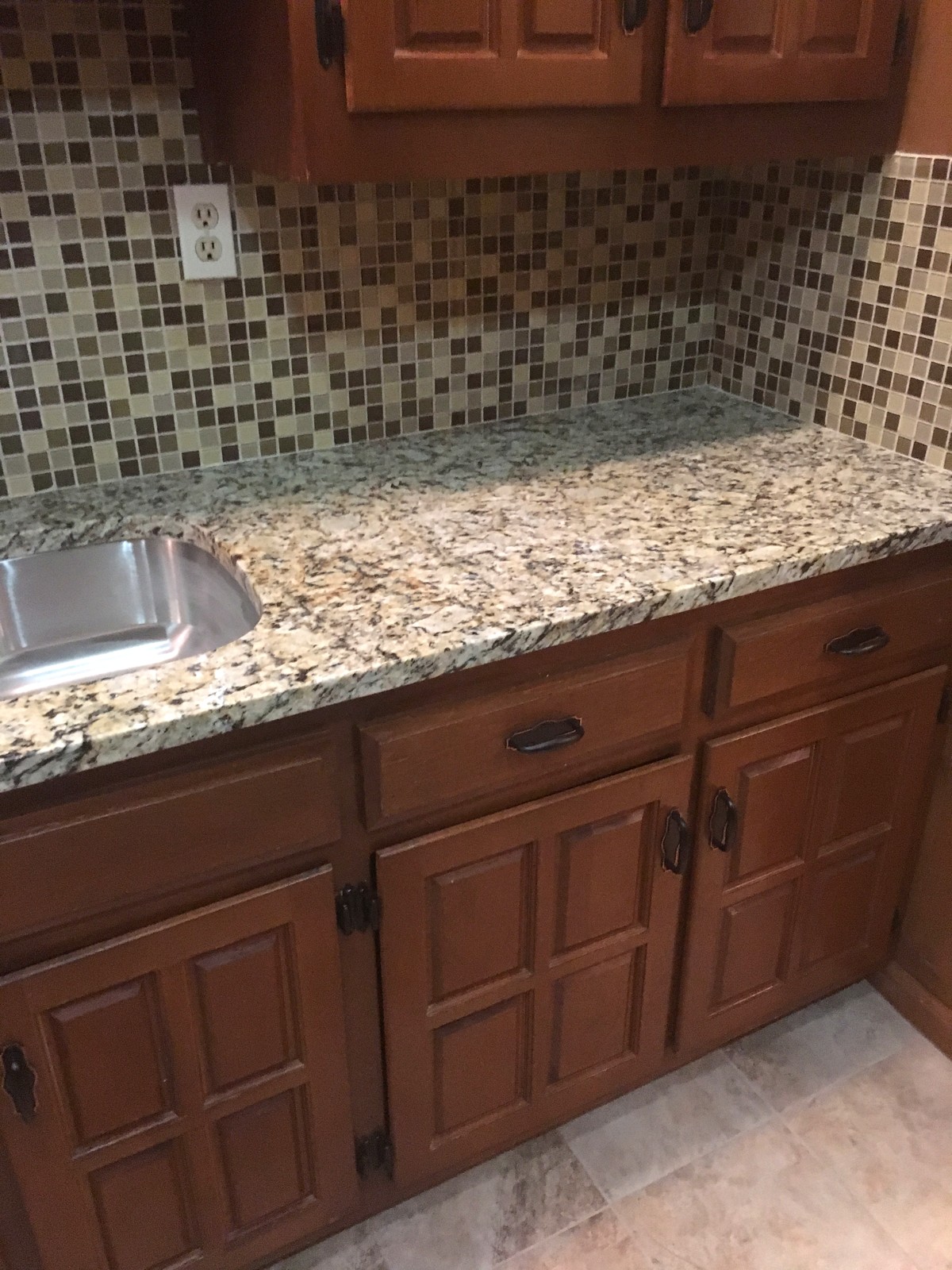 Finished granite countertop with tile backsplash