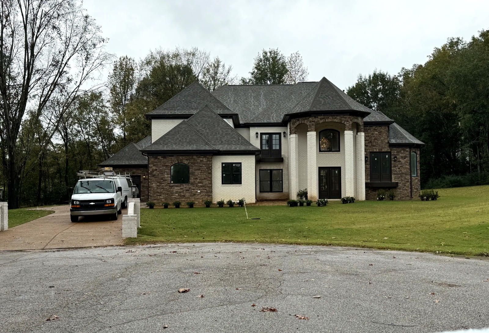 Completed two-story brick and stone new construction home