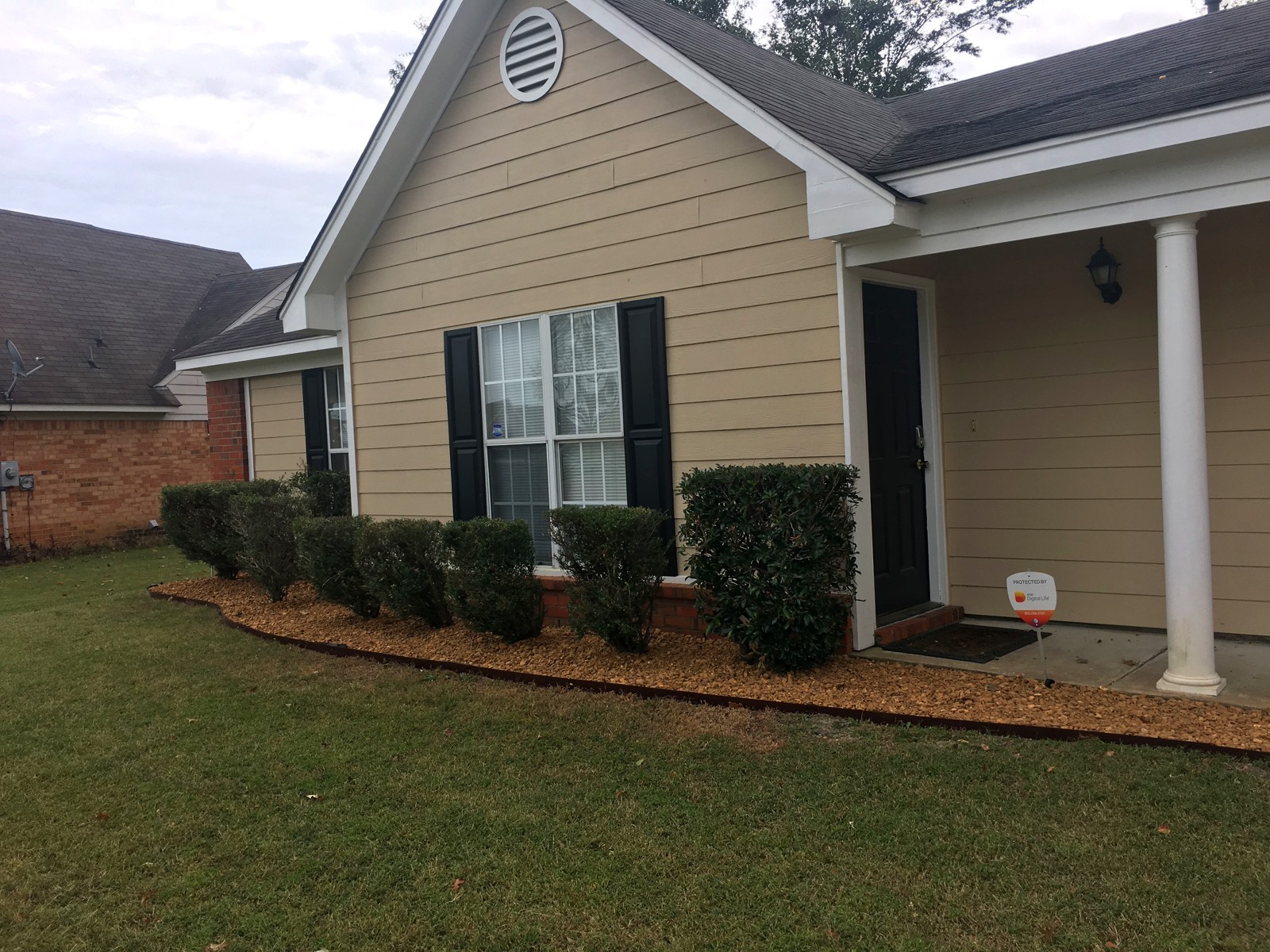 Finished exterior with fresh paint and landscaping
